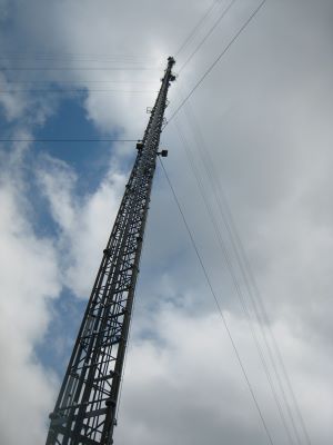 Tall Tower Trace Gas Observatory against the cloudy sky.