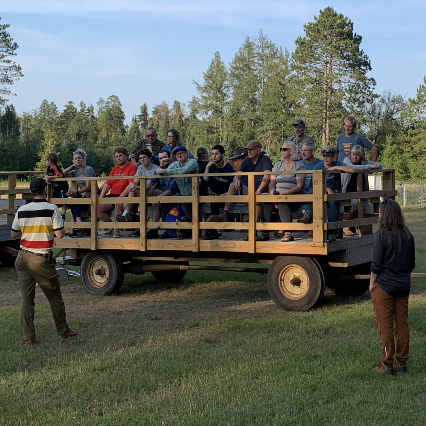 Visitors on a wagon listen to CFC Director Kyle Gill introduce the wagon tour during the Open House.