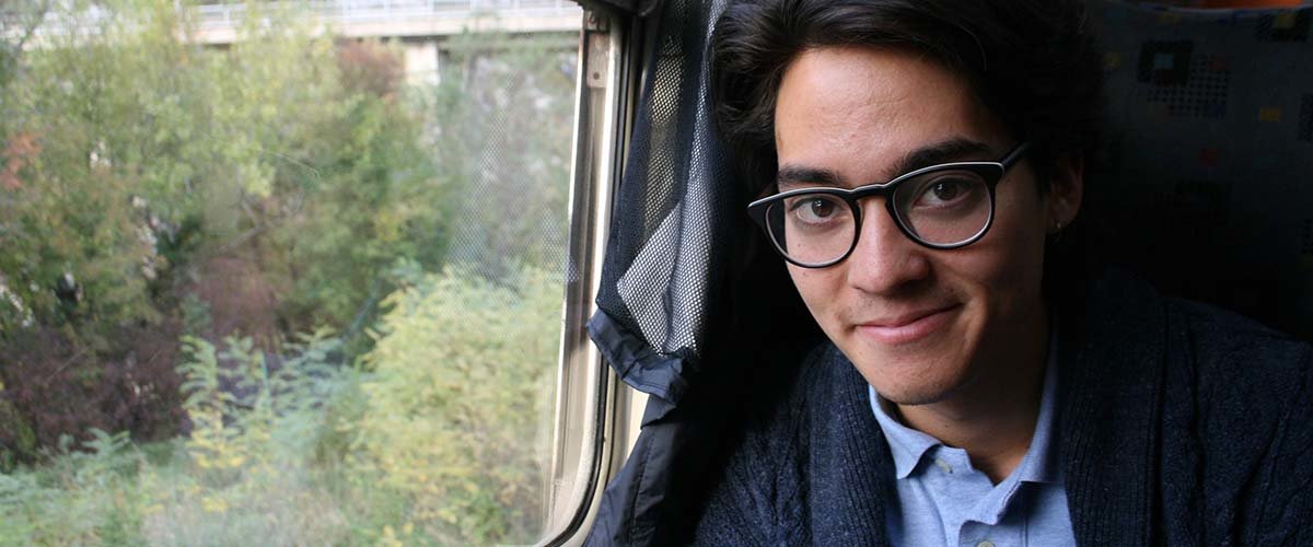 Applied economics alumnus Quentin IkutaSchodde on a train.