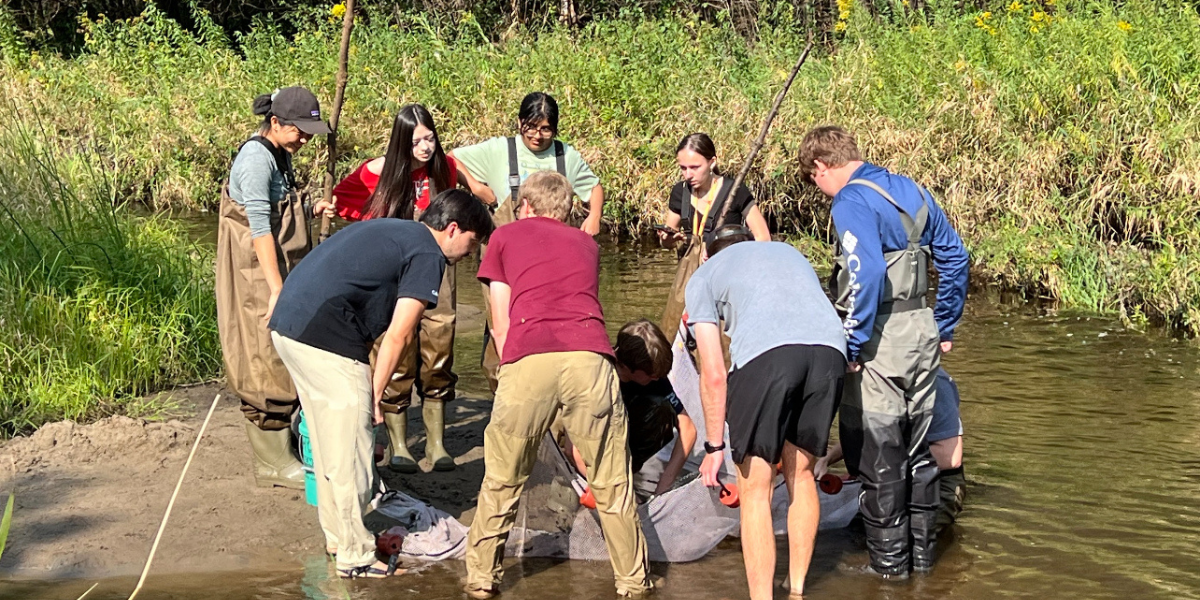 image of club members doing fisheries work