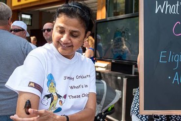 Entomology department head Sujaya Rao with a bug on her arm at the Minnesota State Fair.