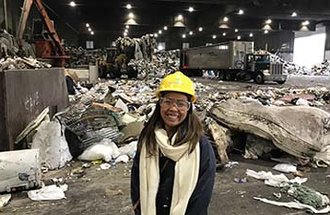 Sustainable systems management alumna Minette Saulog at the Ramsey/Washington County Recycling and Energy Center.