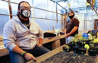 Plant science student Bryant Jones and community leader Clifton Williams.