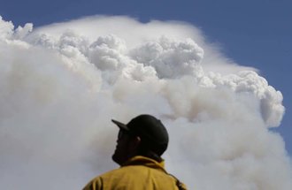 Firefighter Charlie Ferris. Photo credit: Jae C. Hong, AP Photo.