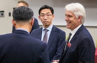 CFANS Dean Brian Buhr speaks with members of the Taiwanese agricultural delegation.