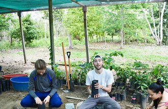 Nico Bacigalupo Zappia, middle, at Finca Las Piedras Biological Research Station in the Western Amazon in Perú.