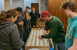 Students race minnows at the 2023 Winter Invitational. 