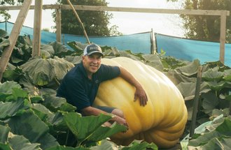 Travis Gienger with pumpkin