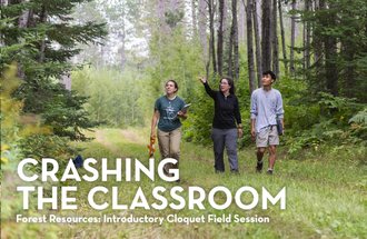 Students and a professor walking in a forest