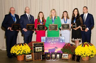 The UMN dairy judging team poses with their awards